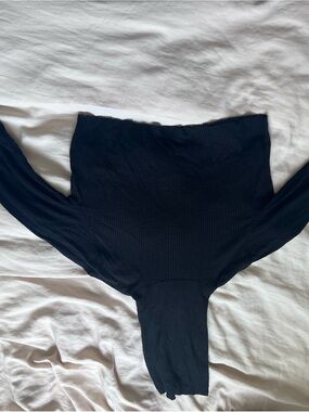 Joah Brown black turtleneck with thumb holes raw edges
